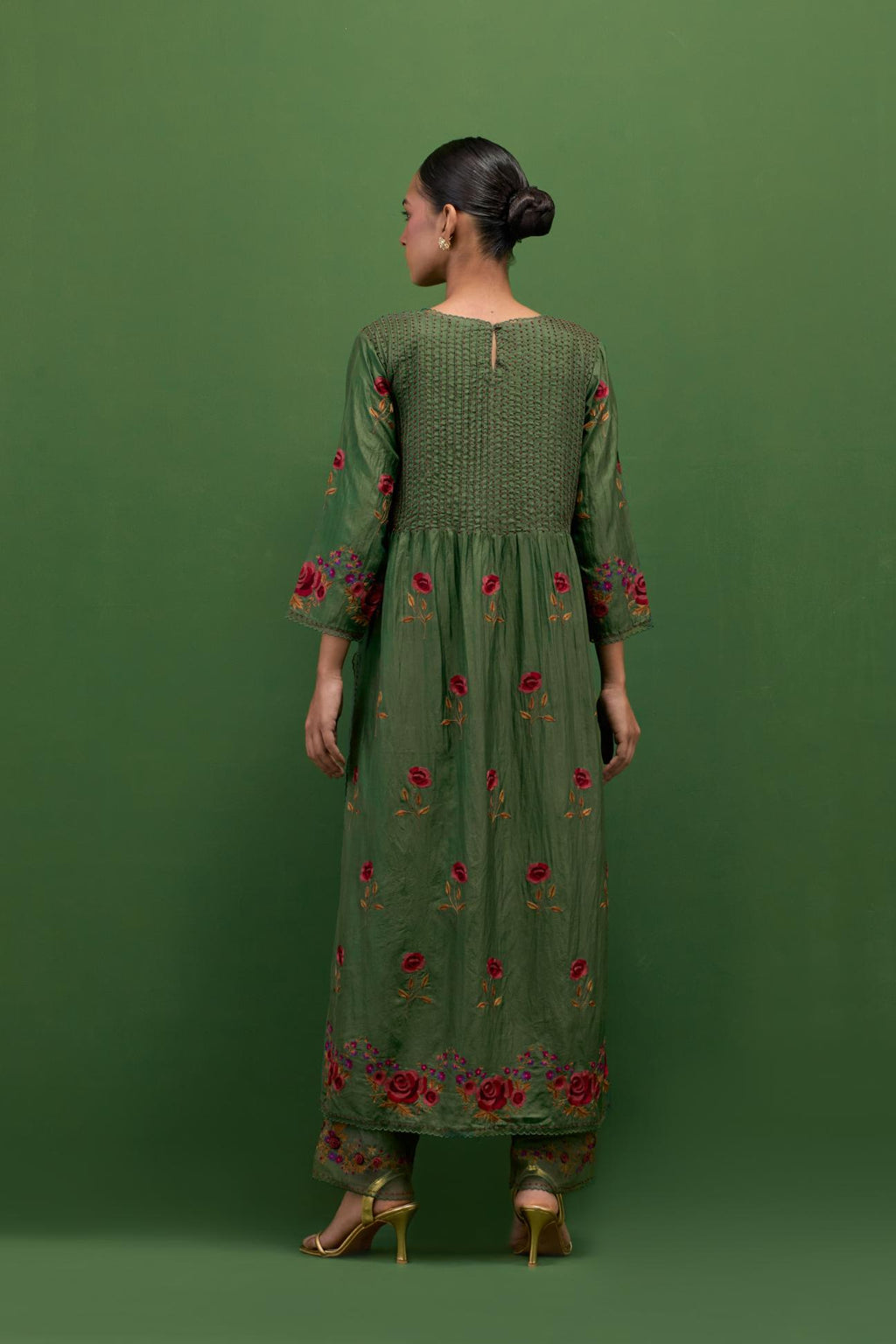 Brunswick green silk kurta set with pin tucks at yoke and all-over rose flower embroidery.