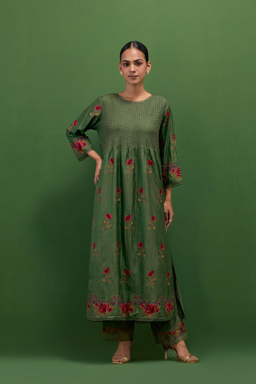 Brunswick green silk kurta set with pin tucks at yoke and all-over rose flower embroidery.