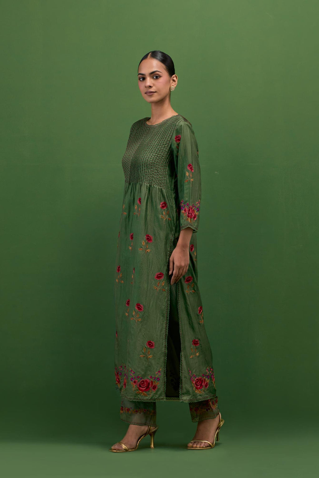 Brunswick green silk kurta set with pin tucks at yoke and all-over rose flower embroidery.