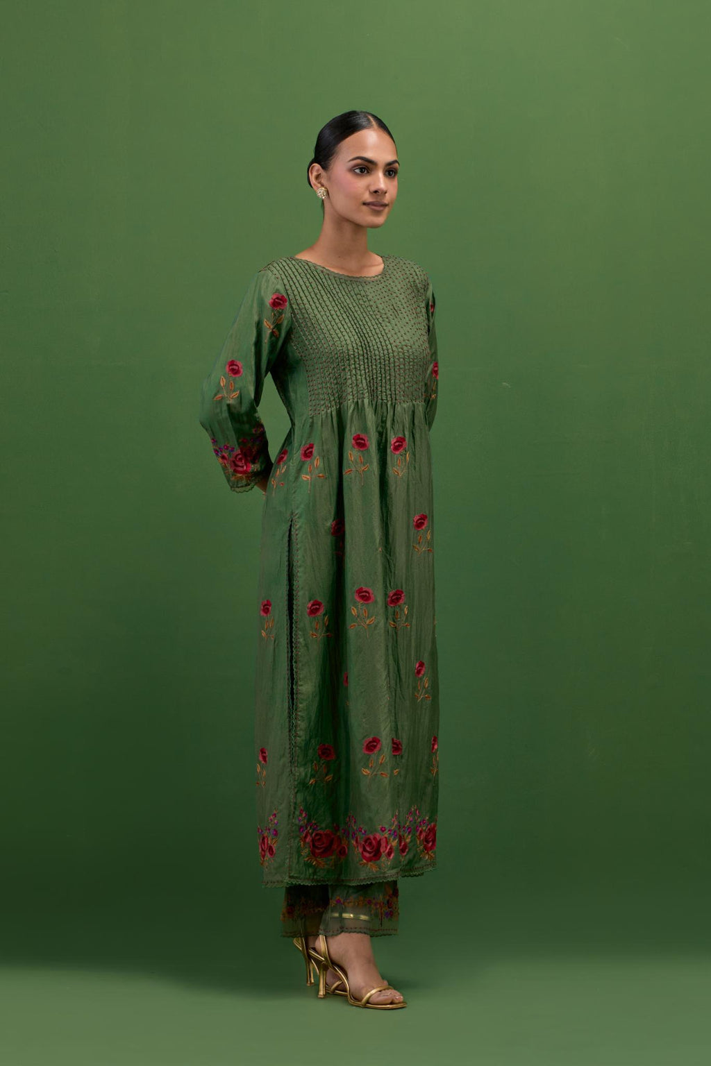 Brunswick green silk kurta set with pin tucks at yoke and all-over rose flower embroidery.