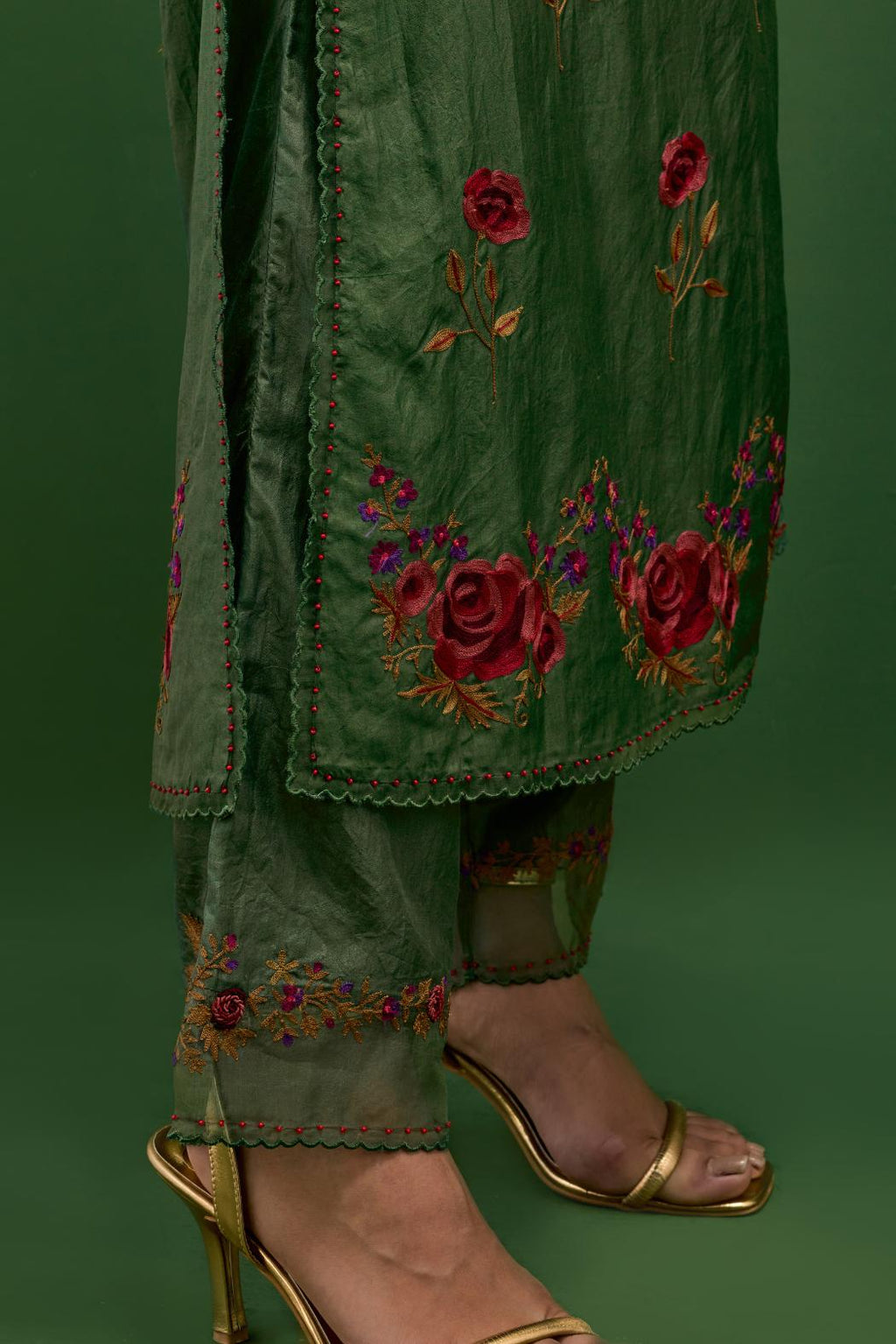 Brunswick green silk kurta set with pin tucks at yoke and all-over rose flower embroidery.