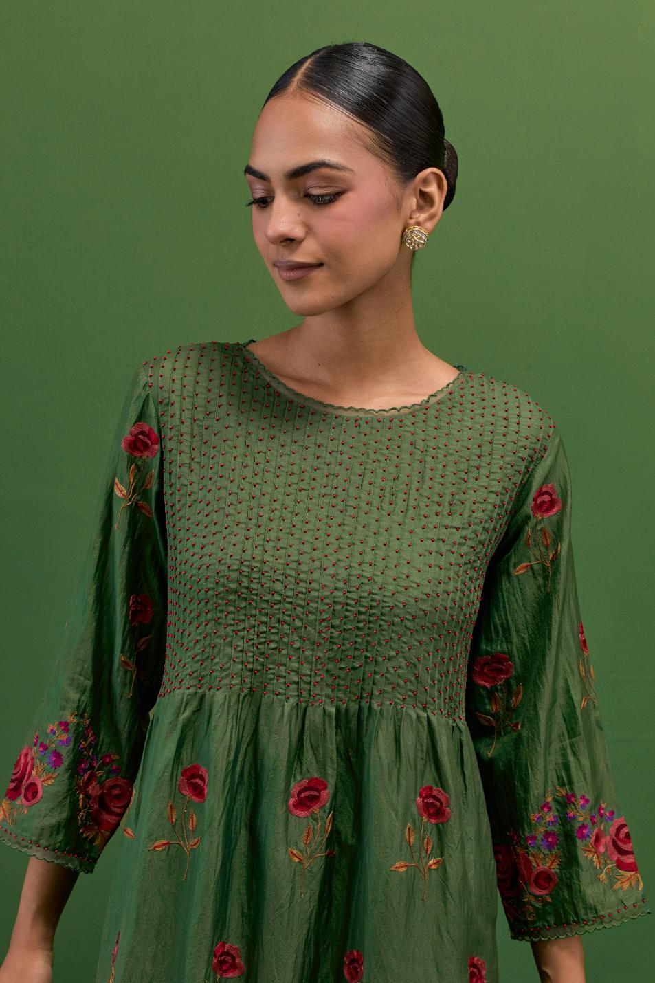 Brunswick green silk kurta set with pin tucks at yoke and all-over rose flower embroidery.