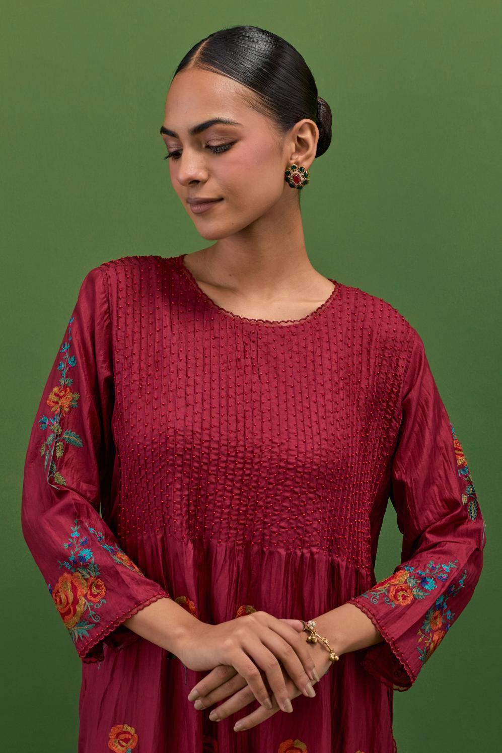 Rosewood silk kurta set with pin tucks at yoke and all-over rose flower embroidery.