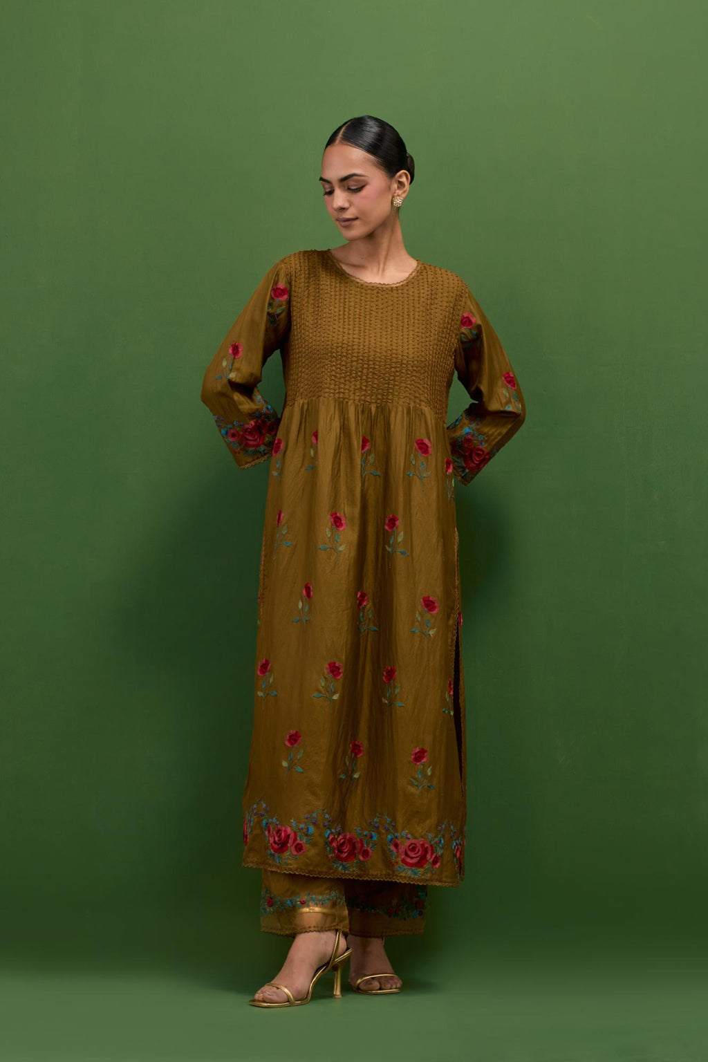 Golden olive silk kurta set with pin tucks at yoke and all-over rose flower embroidery.