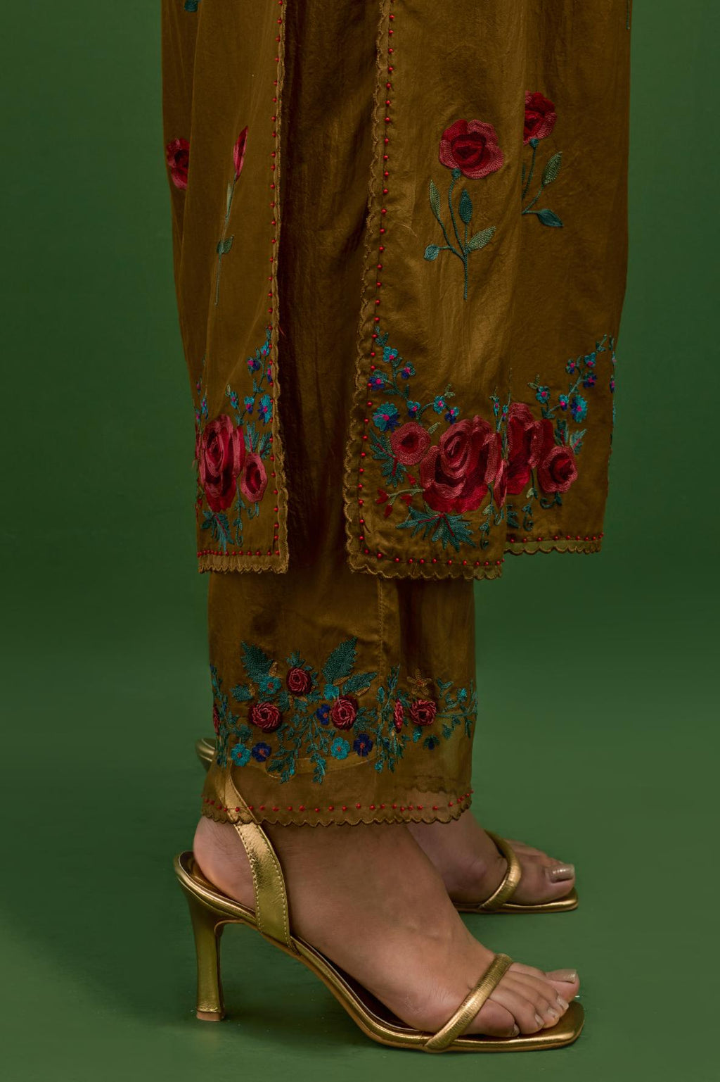 Golden olive silk kurta set with pin tucks at yoke and all-over rose flower embroidery.