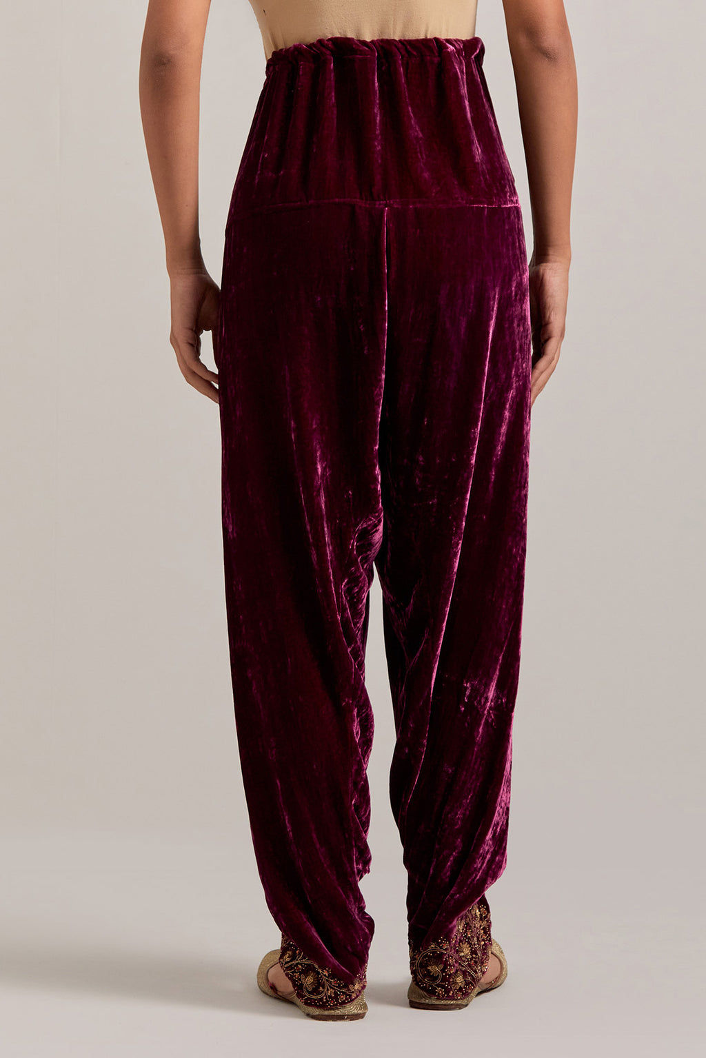 Plum Silk velvet salwar, highlighted with hand embroidered bead, sequins, zardozi and zari boota at bottom hem.