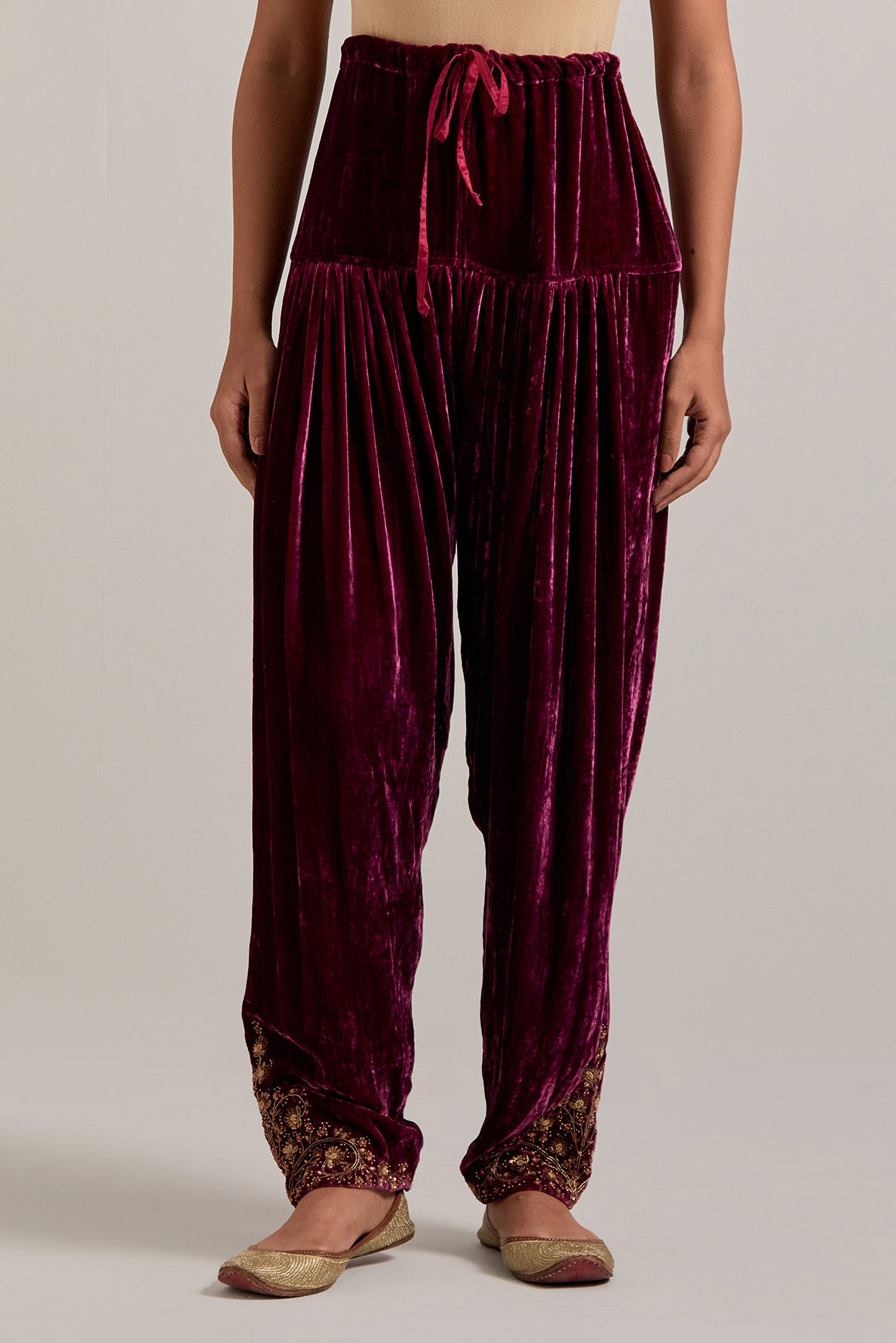 Plum Silk velvet salwar, highlighted with hand embroidered bead, sequins, zardozi and zari boota at bottom hem.