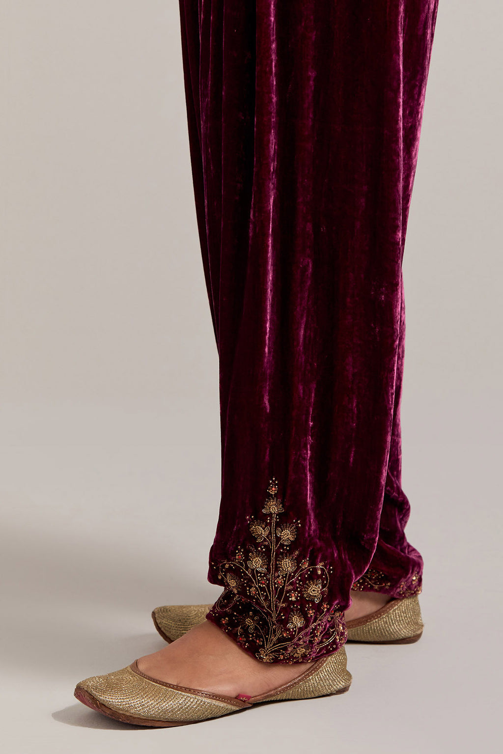 Plum Silk velvet salwar, highlighted with hand embroidered bead, sequins, zardozi and zari boota at bottom hem.