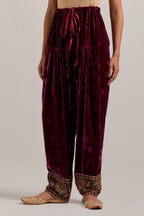 Plum Silk velvet salwar, highlighted with hand embroidered bead, sequins, zardozi and zari border at bottom hem.