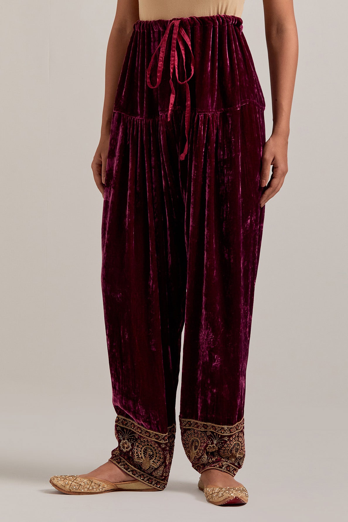 Plum Silk velvet salwar, highlighted with hand embroidered bead, sequins, zardozi and zari border at bottom hem.