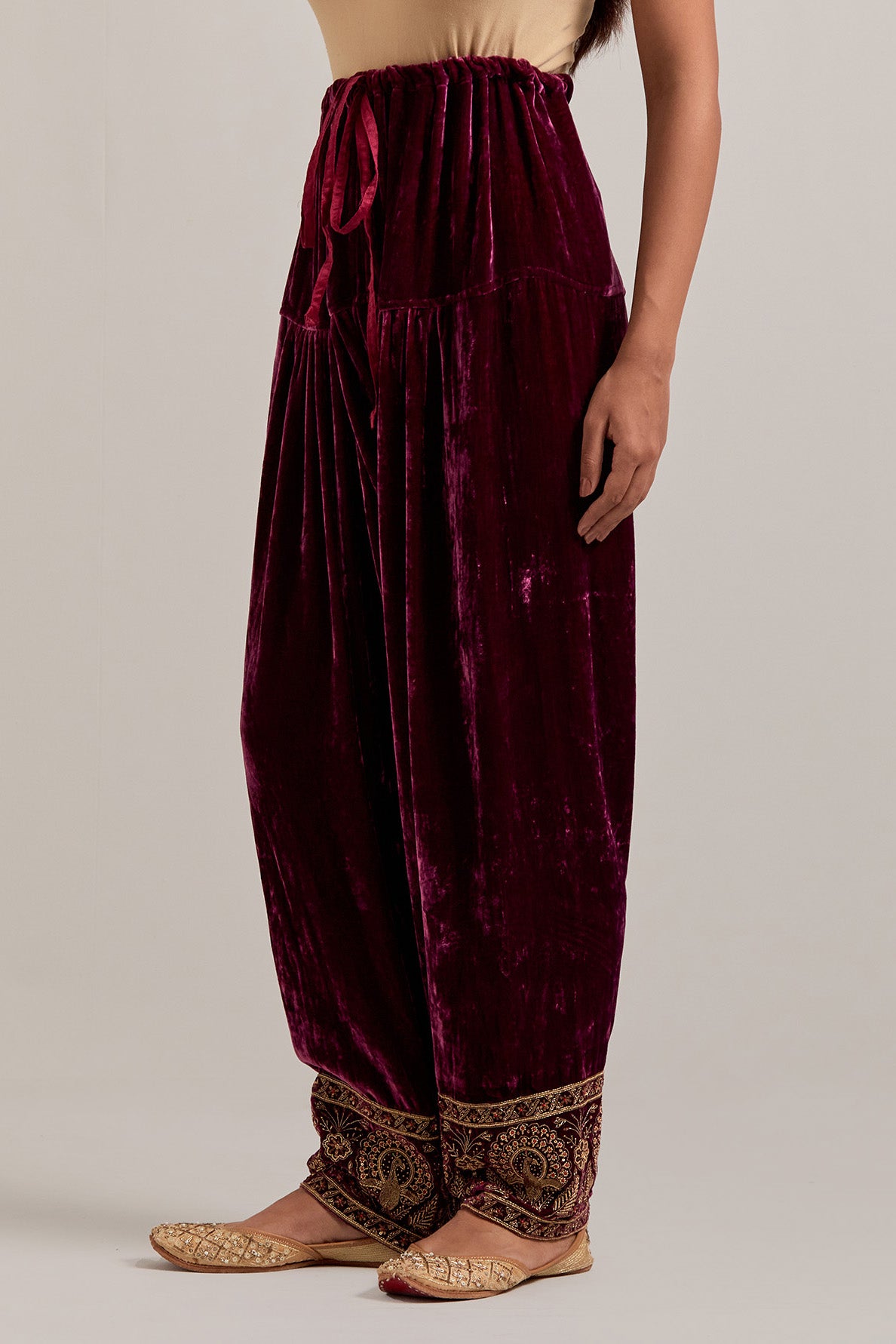 Plum Silk velvet salwar, highlighted with hand embroidered bead, sequins, zardozi and zari border at bottom hem.