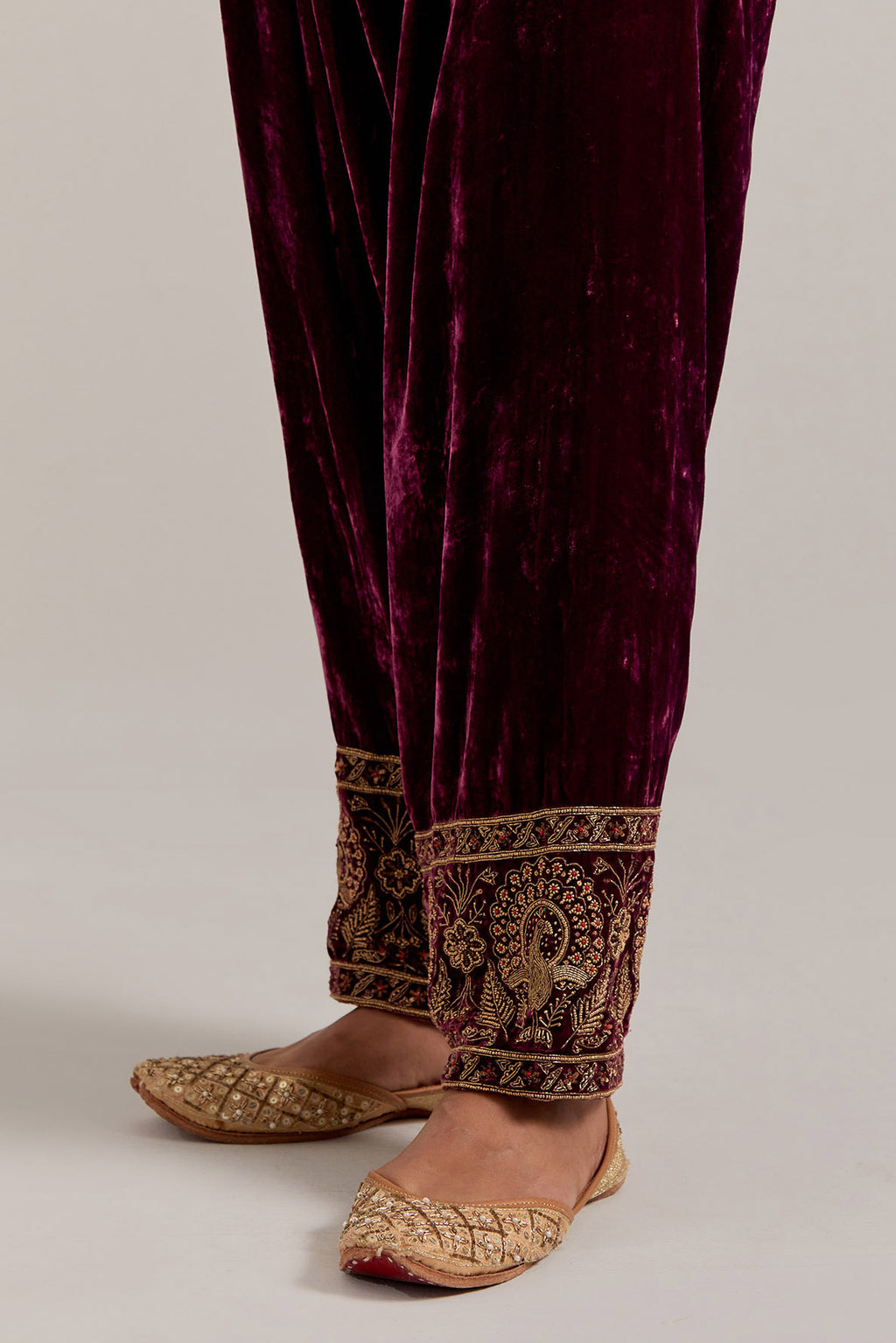 Plum Silk velvet salwar, highlighted with hand embroidered bead, sequins, zardozi and zari border at bottom hem.