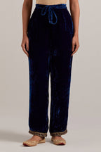 Navy blue Silk velvet pants, highlighted with hand embroidered bead, sequins, zardozi and zari narrow border at bottom hem.