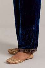 Navy blue Silk velvet pants, highlighted with hand embroidered bead, sequins, zardozi and zari narrow border at bottom hem.