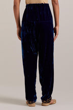 Navy blue Silk velvet salwar, highlighted with hand embroidered bead, sequins, zardozi and zari boota at bottom hem.