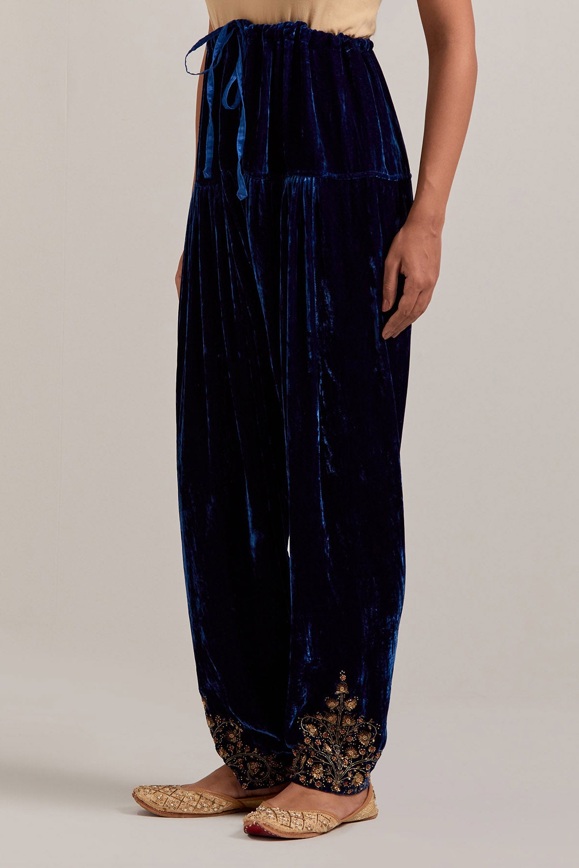 Navy blue Silk velvet salwar, highlighted with hand embroidered bead, sequins, zardozi and zari boota at bottom hem.