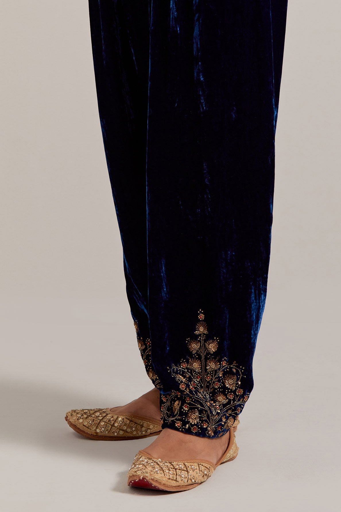 Navy blue Silk velvet salwar, highlighted with hand embroidered bead, sequins, zardozi and zari boota at bottom hem.