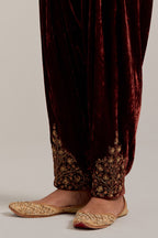 Burnt umber Silk velvet salwar, highlighted with hand embroidered bead, sequins, zardozi and zari boota at bottom hem.