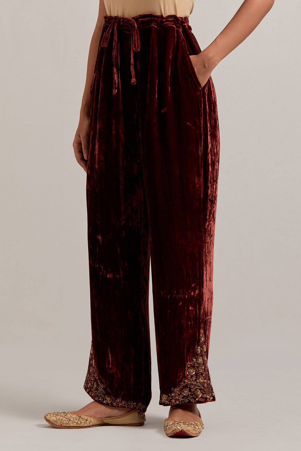 Burnt umber Silk velvet pants, highlighted with hand embroidered bead, sequins, zardozi and zari boota at bottom hem.