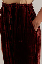 Burnt umber Silk velvet pants, highlighted with hand embroidered bead, sequins, zardozi and zari boota at bottom hem.