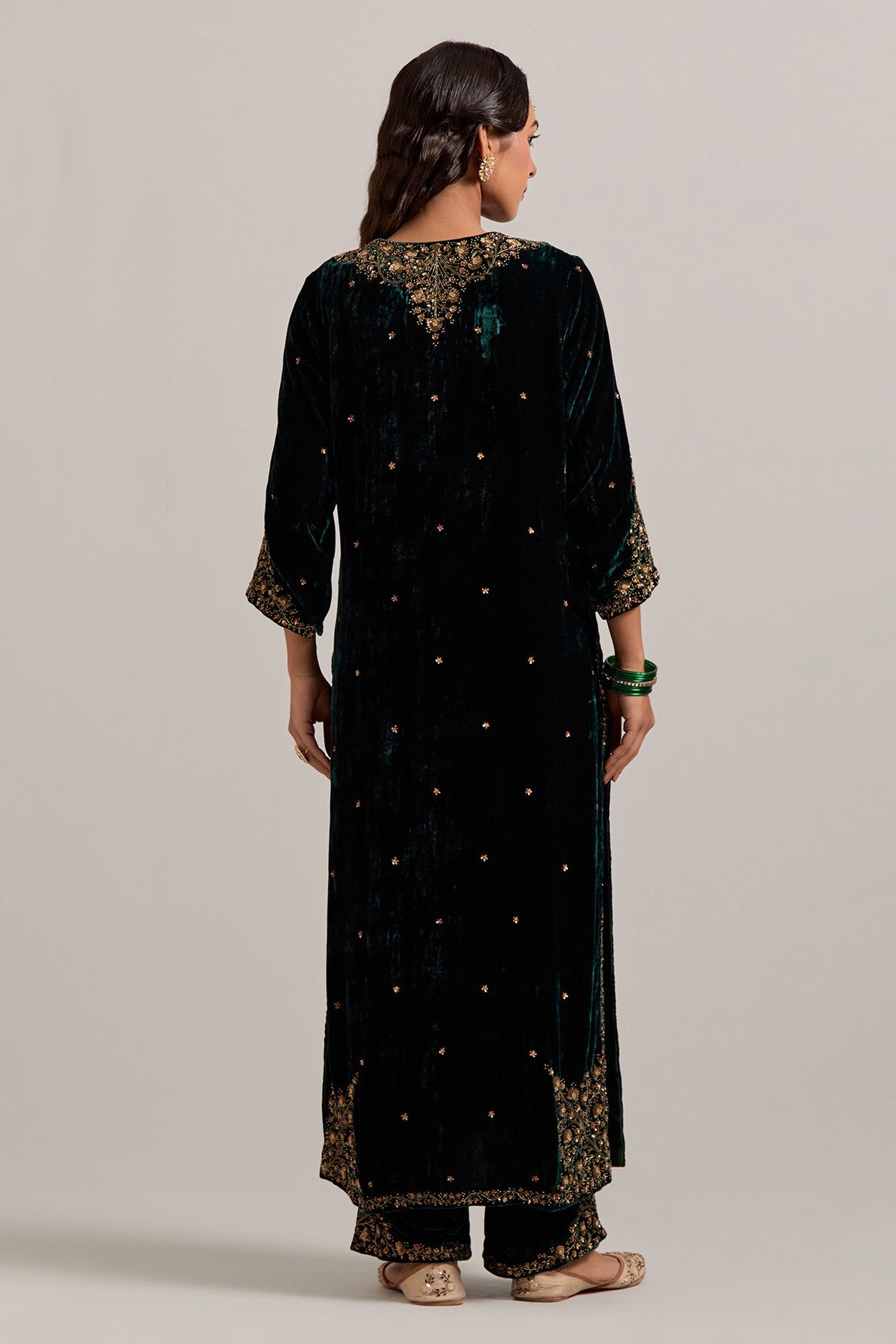 Dark green straight Silk Velvet kurta set with all-over hand-embroidered bead, sequins, zardozi and zari work.