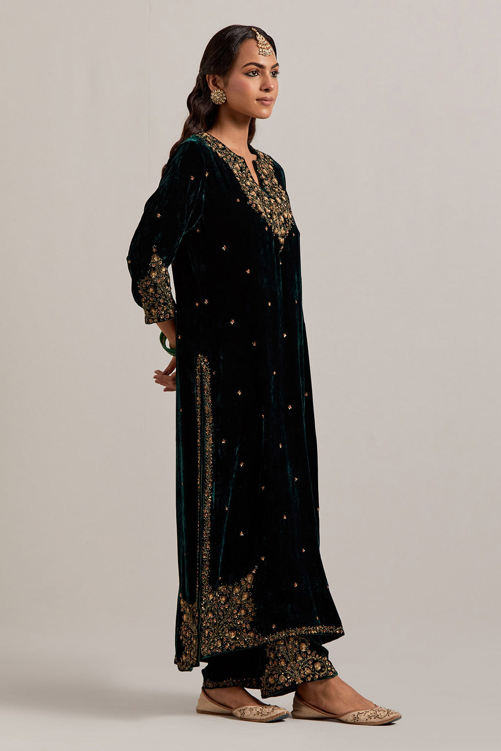 Dark green straight Silk Velvet kurta set with all-over hand-embroidered bead, sequins, zardozi and zari work.