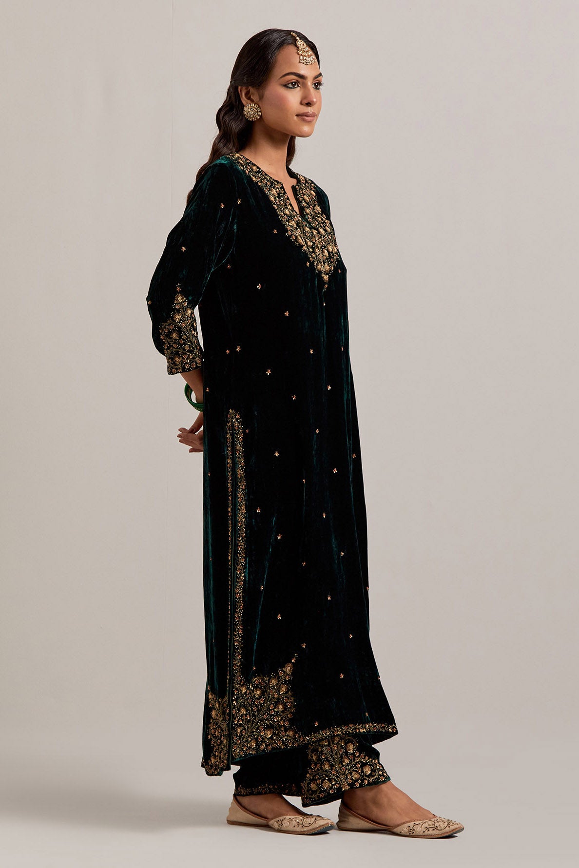 Dark green straight Silk Velvet kurta set with all-over hand-embroidered bead, sequins, zardozi and zari work.