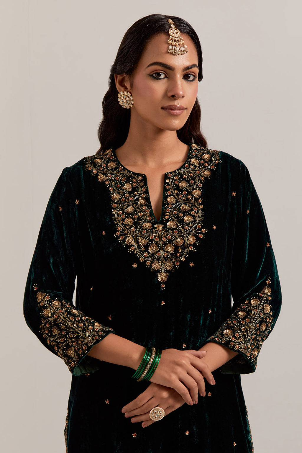 Dark green straight Silk Velvet kurta set with all-over hand-embroidered bead, sequins, zardozi and zari work.
