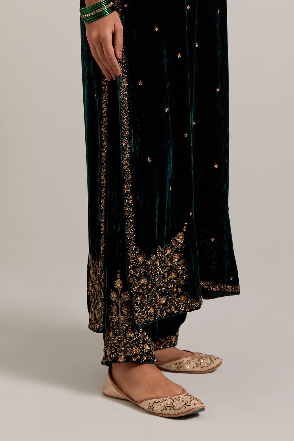 Dark green straight Silk Velvet kurta set with all-over hand-embroidered bead, sequins, zardozi and zari work.