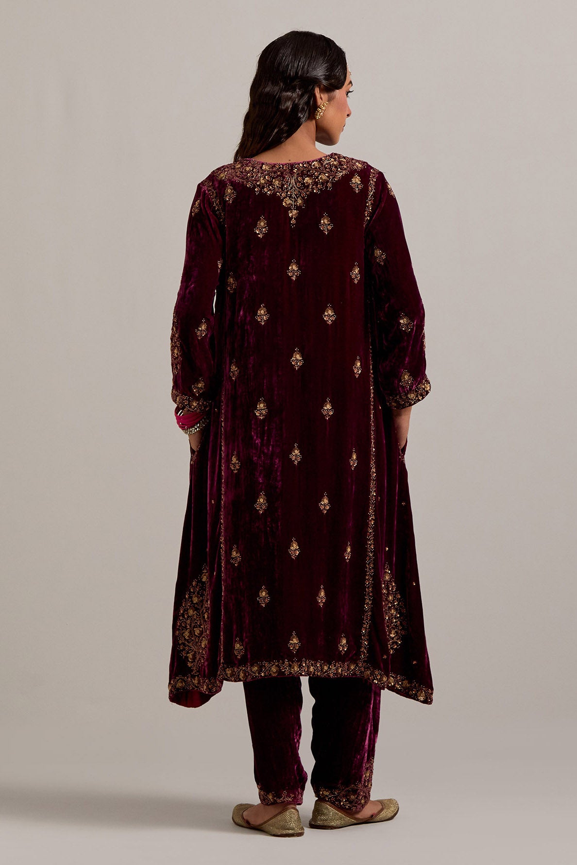 Plum easy fit A-line, panelled, short kurta set in silk velvet with all-over hand embroidery at the neck, sleeves and hem.