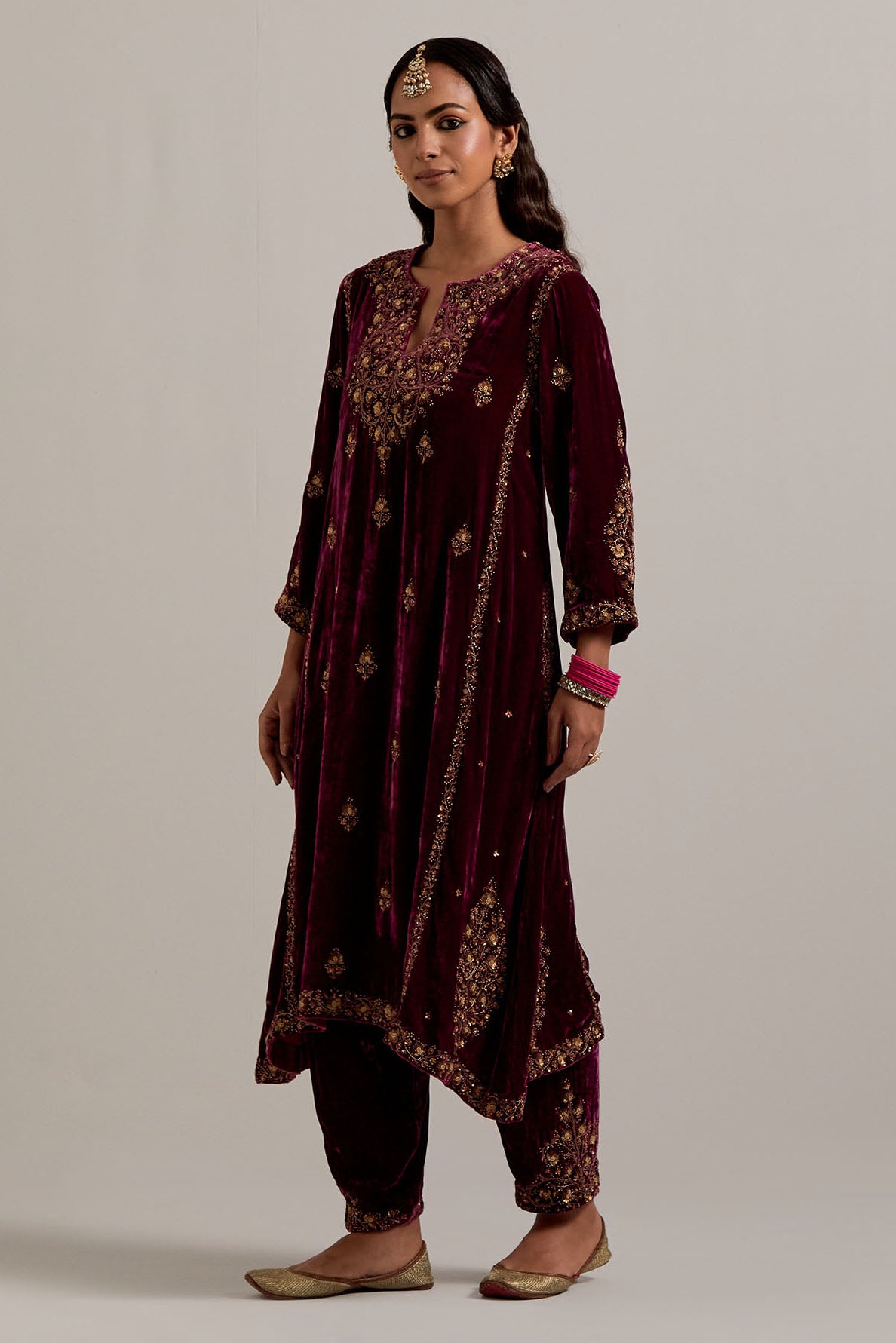 Plum easy fit A-line, panelled, short kurta set in silk velvet with all-over hand embroidery at the neck, sleeves and hem.