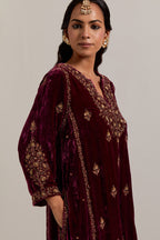 Plum easy fit A-line, panelled, short kurta set in silk velvet with all-over hand embroidery at the neck, sleeves and hem.
