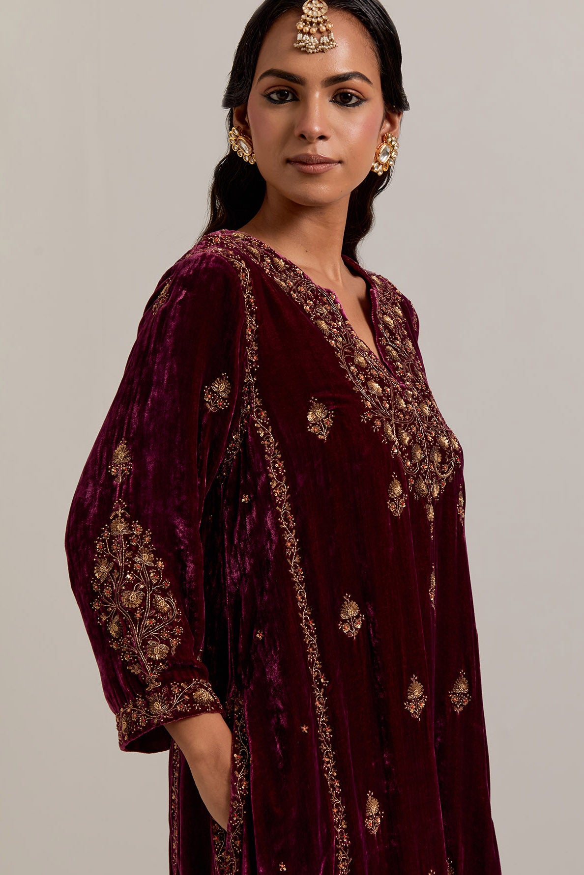 Plum easy fit A-line, panelled, short kurta set in silk velvet with all-over hand embroidery at the neck, sleeves and hem.