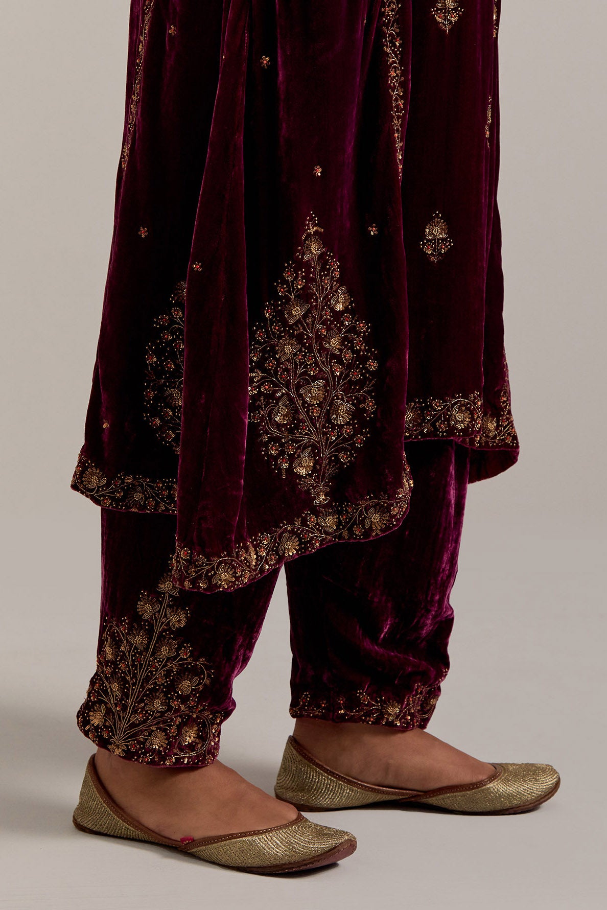 Plum easy fit A-line, panelled, short kurta set in silk velvet with all-over hand embroidery at the neck, sleeves and hem.