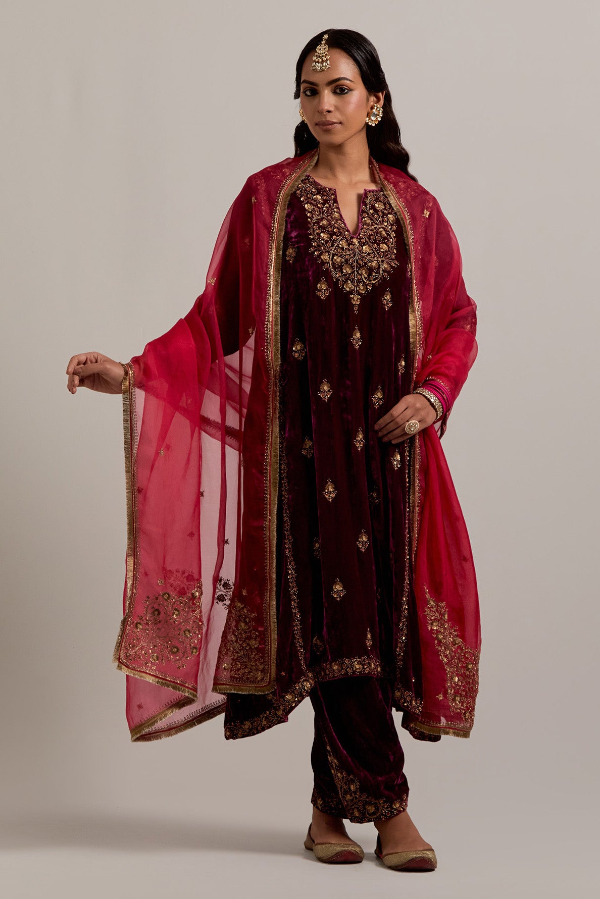 Plum easy fit A-line, panelled, short kurta set in silk velvet with all-over hand embroidery at the neck, sleeves and hem.