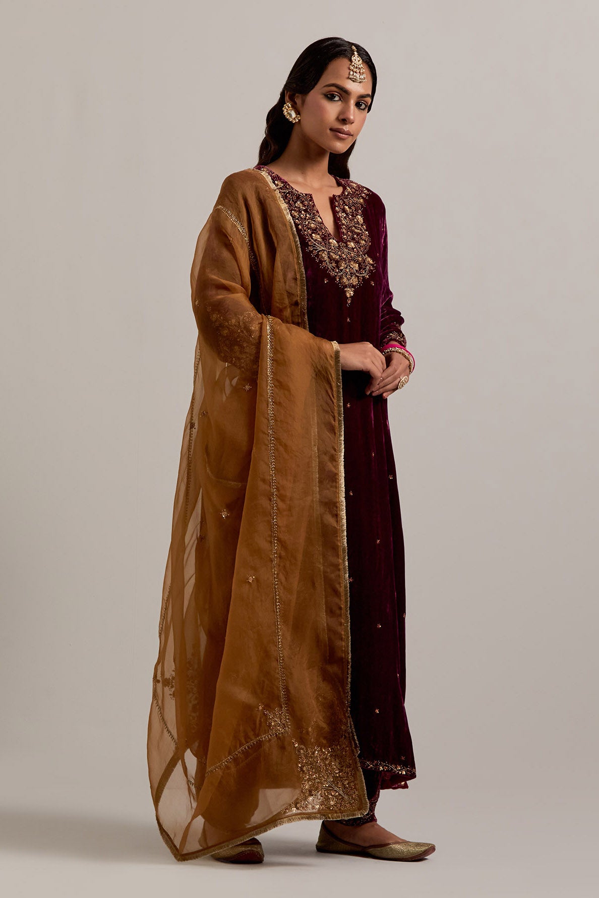 Plum straight Silk Velvet kurta set with all-over hand-embroidered bead, sequins, zardozi and zari work.
