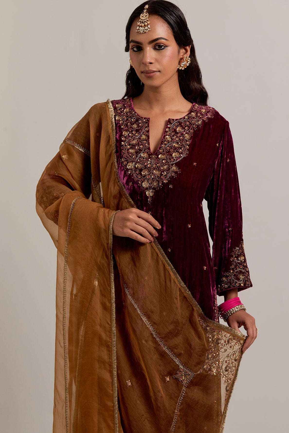 Plum straight Silk Velvet kurta set with all-over hand-embroidered bead, sequins, zardozi and zari work.