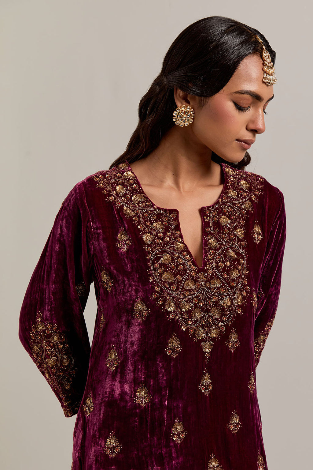 Plum straight Silk Velvet short kurta set with all-over hand-embroidered bead, sequins, zardozi and zari work.