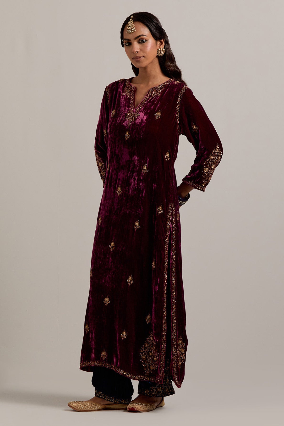 Plum straight Silk Velvet kurta set with all-over hand-embroidered small floral booti with sequins, zardozi, bead and zari work.