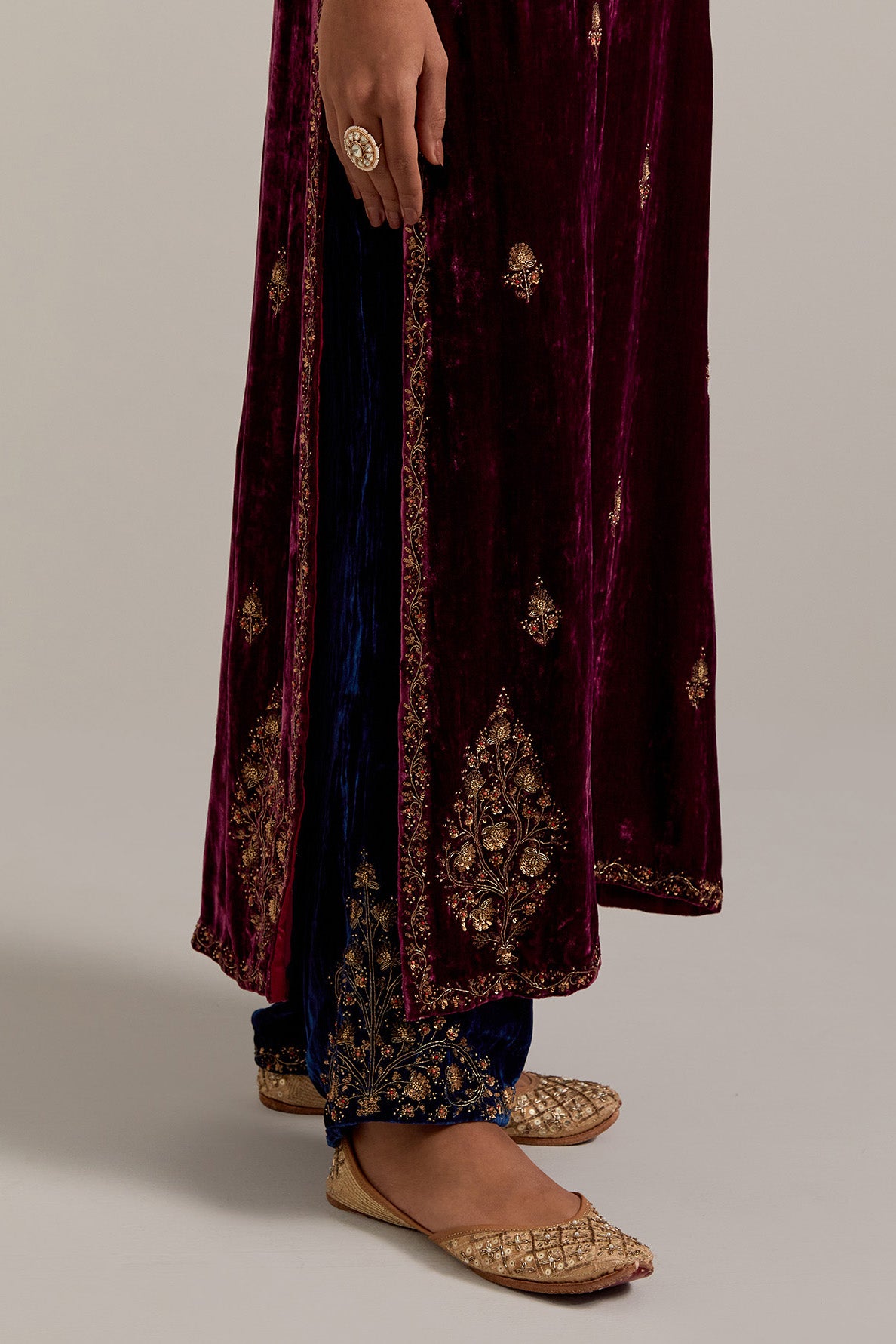 Plum straight Silk Velvet kurta set with all-over hand-embroidered small floral booti with sequins, zardozi, bead and zari work.