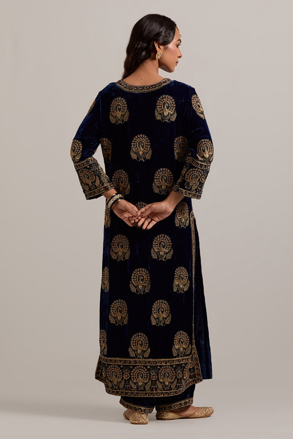 Navy blue silk velvet straight kurta set with sequins, zardozi, zari embroidered peacock boota all-over the kurta, highlighted with contrast bead work.
