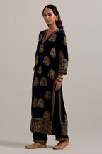 Navy blue silk velvet straight kurta set with sequins, zardozi, zari embroidered peacock boota all-over the kurta, highlighted with contrast bead work.
