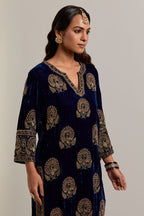 Navy blue silk velvet straight kurta set with sequins, zardozi, zari embroidered peacock boota all-over the kurta, highlighted with contrast bead work.