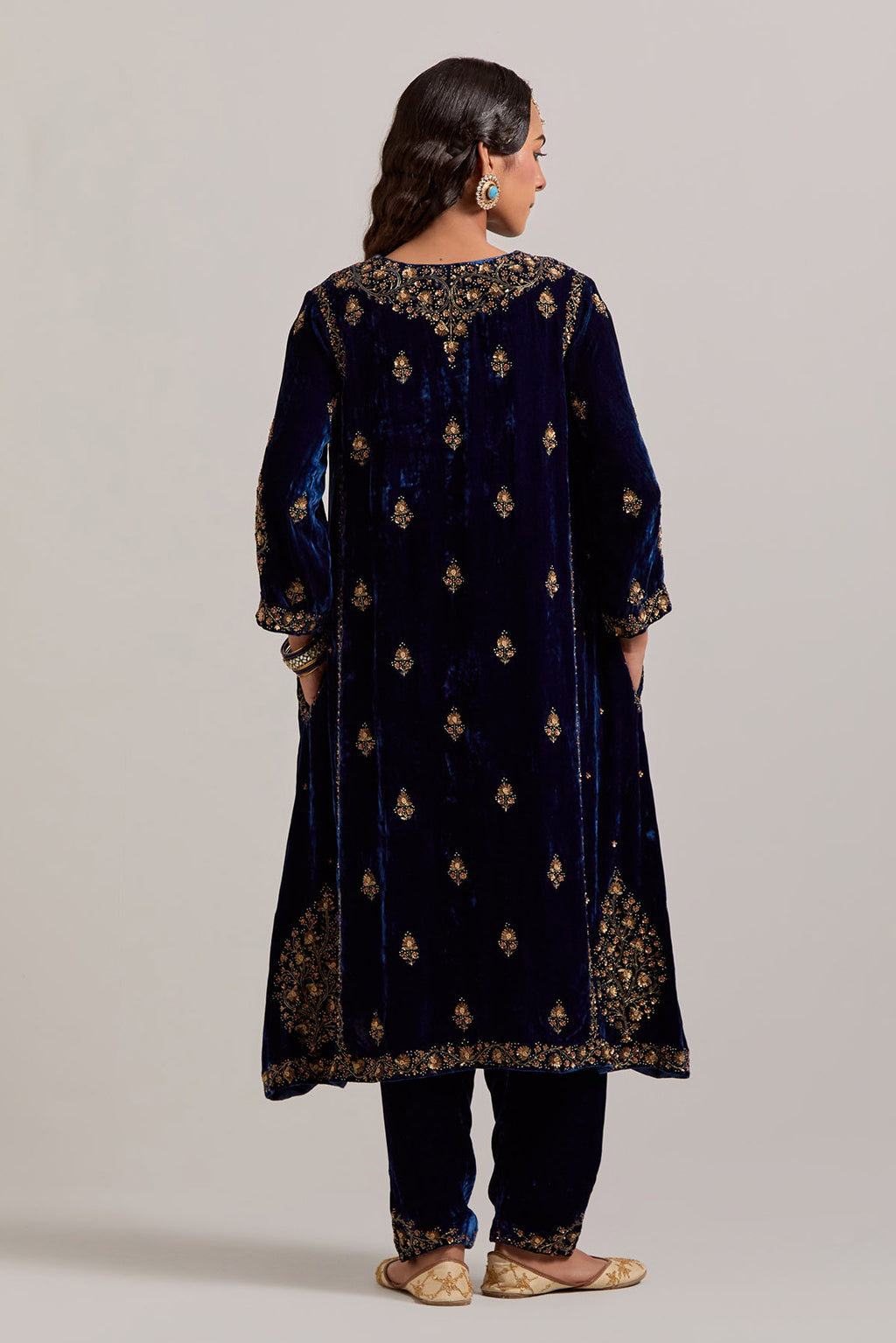 Navy blue easy fit A-line, panelled, short kurta set in silk velvet with all-over hand embroidery at the neck, sleeves and hem.