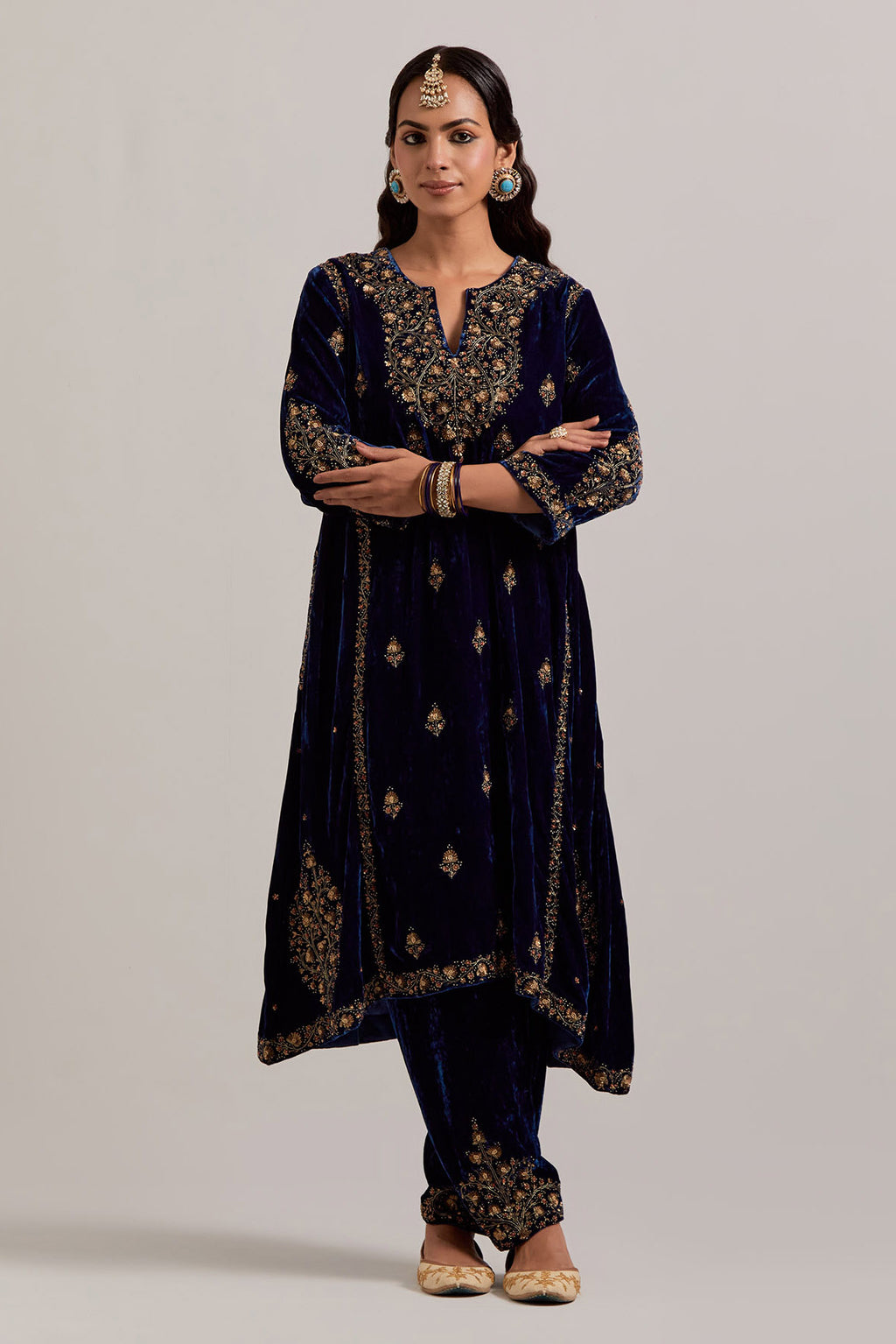 Navy blue easy fit A-line, panelled, short kurta set in silk velvet with all-over hand embroidery at the neck, sleeves and hem.