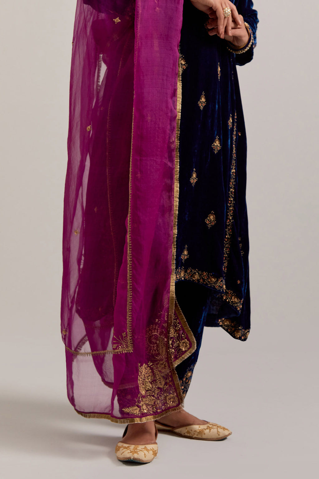 Navy blue easy fit A-line, panelled, short kurta set in silk velvet with all-over hand embroidery at the neck, sleeves and hem.