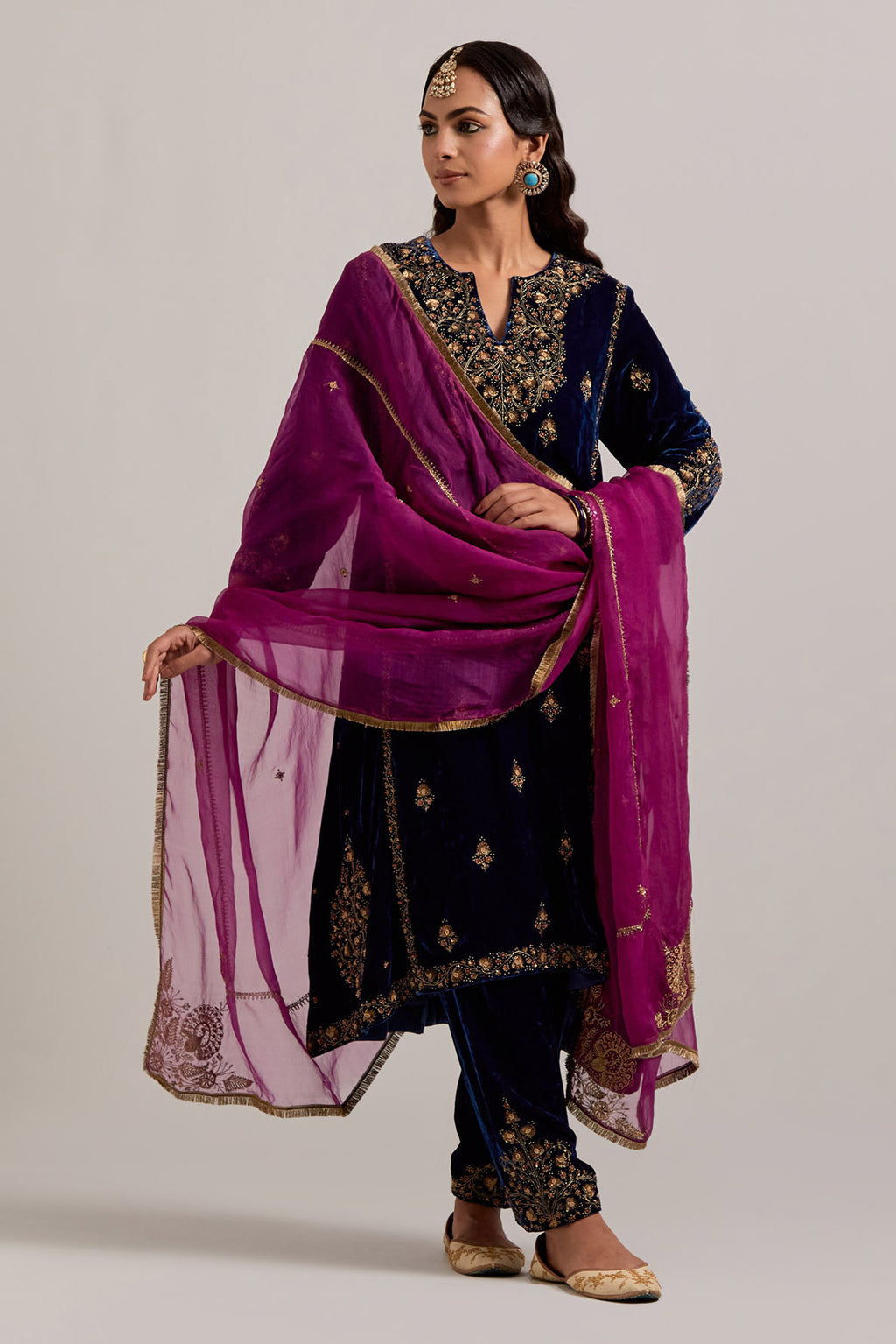 Navy blue easy fit A-line, panelled, short kurta set in silk velvet with all-over hand embroidery at the neck, sleeves and hem.