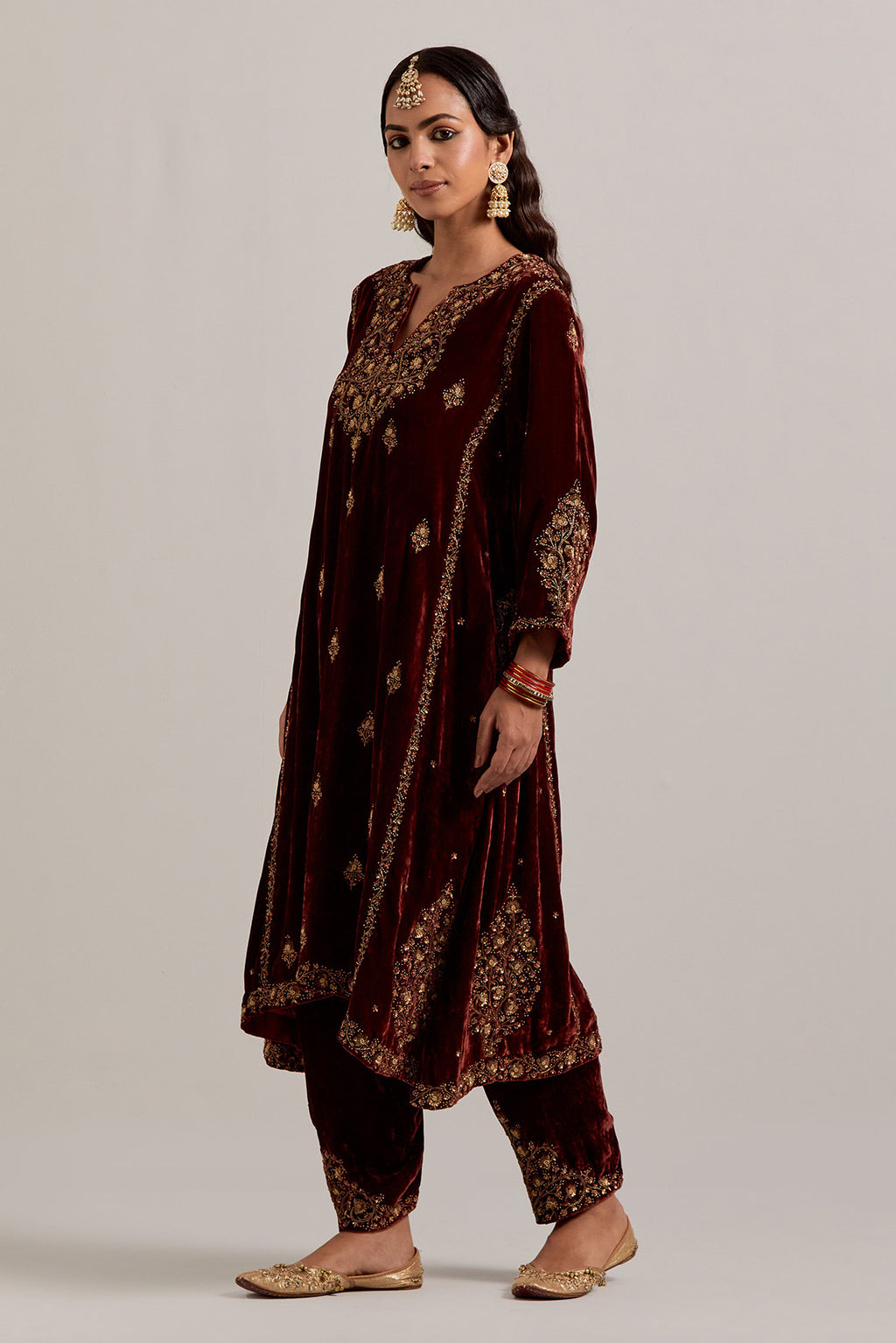 Burnt umber easy fit A-line, panelled, short kurta set in silk velvet with all-over hand embroidery at the neck, sleeves and hem.