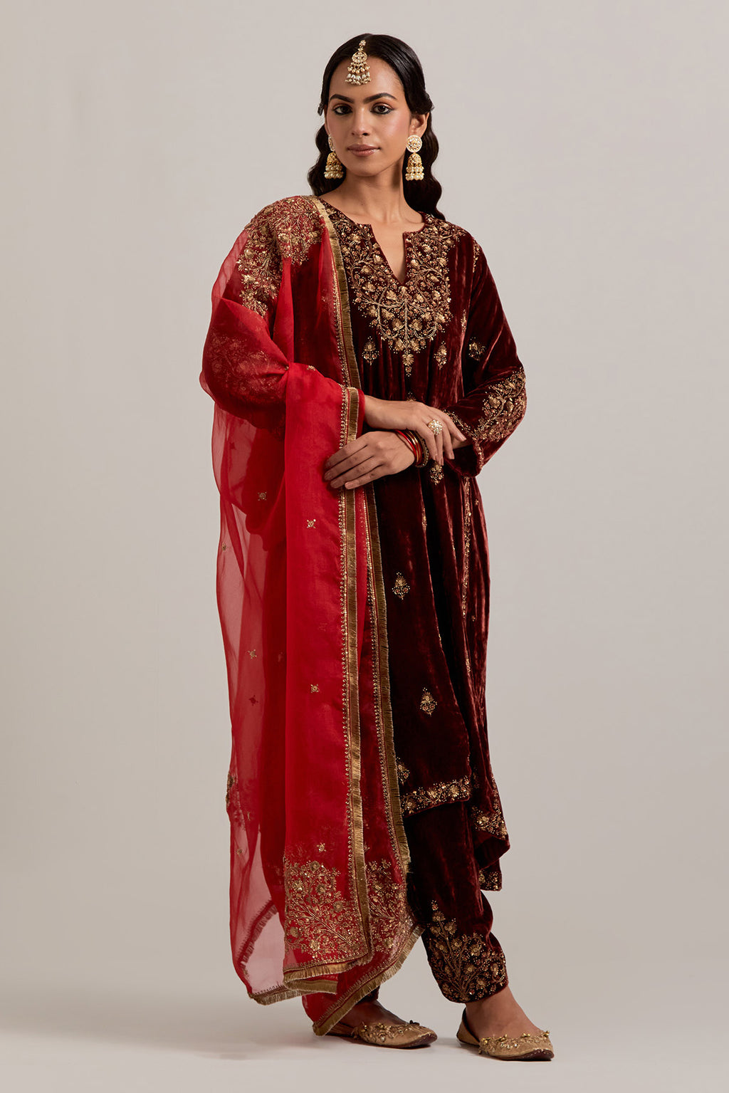 Burnt umber easy fit A-line, panelled, short kurta set in silk velvet with all-over hand embroidery at the neck, sleeves and hem.