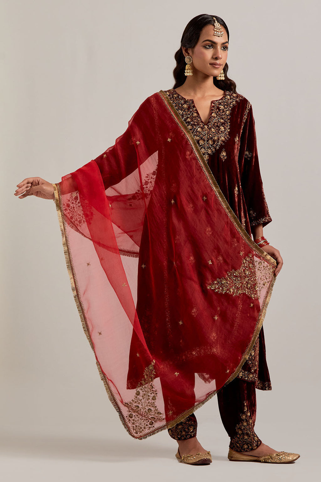 Burnt umber easy fit A-line, panelled, short kurta set in silk velvet with all-over hand embroidery at the neck, sleeves and hem.